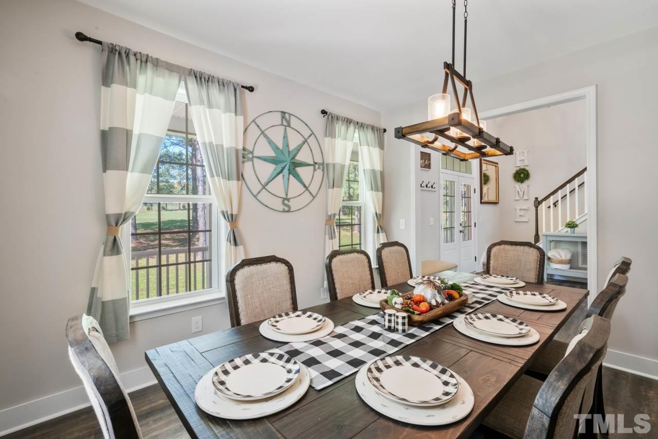 7255 Highway 231 Middlesex, NC 27557 - Photo 6 of 27 a dining room with furniture and a chandelier