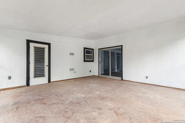 a view of a backyard with plants and a garden