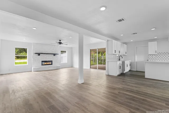 a view of kitchen and kitchen with furniture wooden floor and window