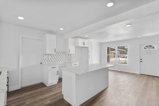 a view of a big room with carpet