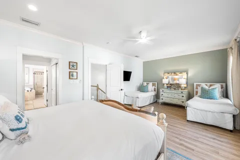a spacious bedroom with a bed and a large mirror