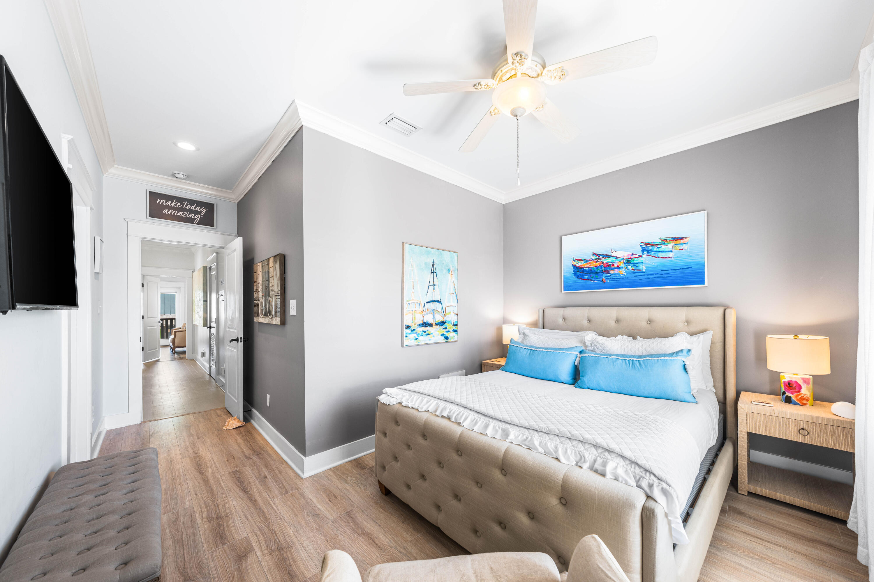 59 Endless Summer Way West Inlet Beach, FL 32461 - Photo 20 of 40 a bedroom with a large bed and a chandelier