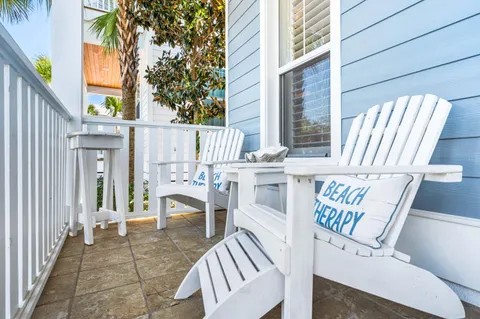 a view of a patio with a table and chairs