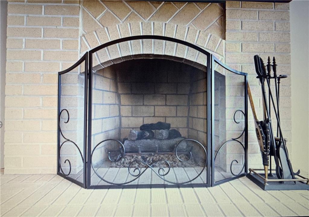 8 Ridgemead Fields Drive Verona, PA 15147 - Photo 11 of 22 Brick to ceiling Gas Log Fireplace with screen and tools.