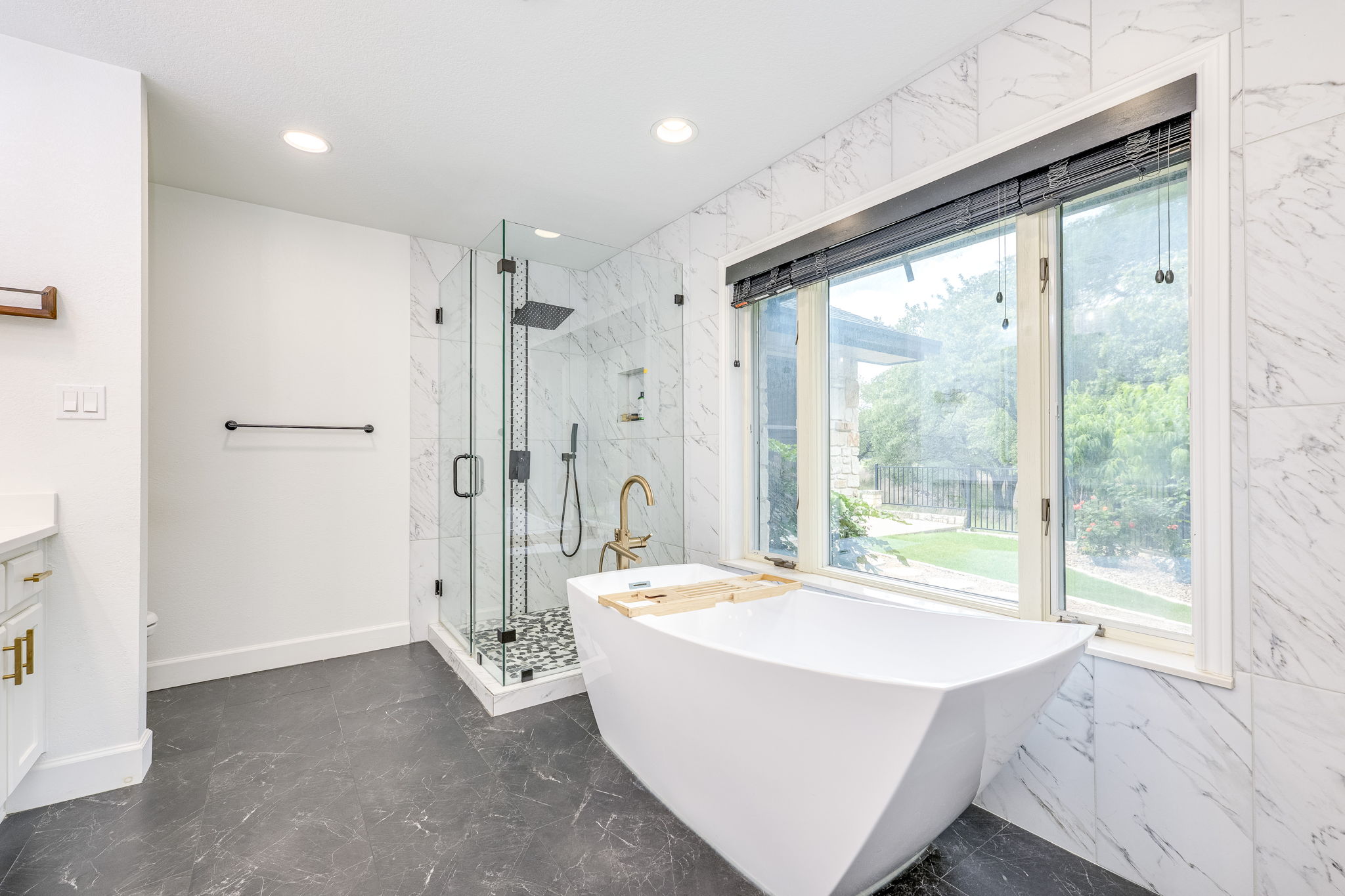 320 Greenridge Road Georgetown, TX 78628 - Photo 24 of 38 a large white tub sitting in a bathroom next to a window