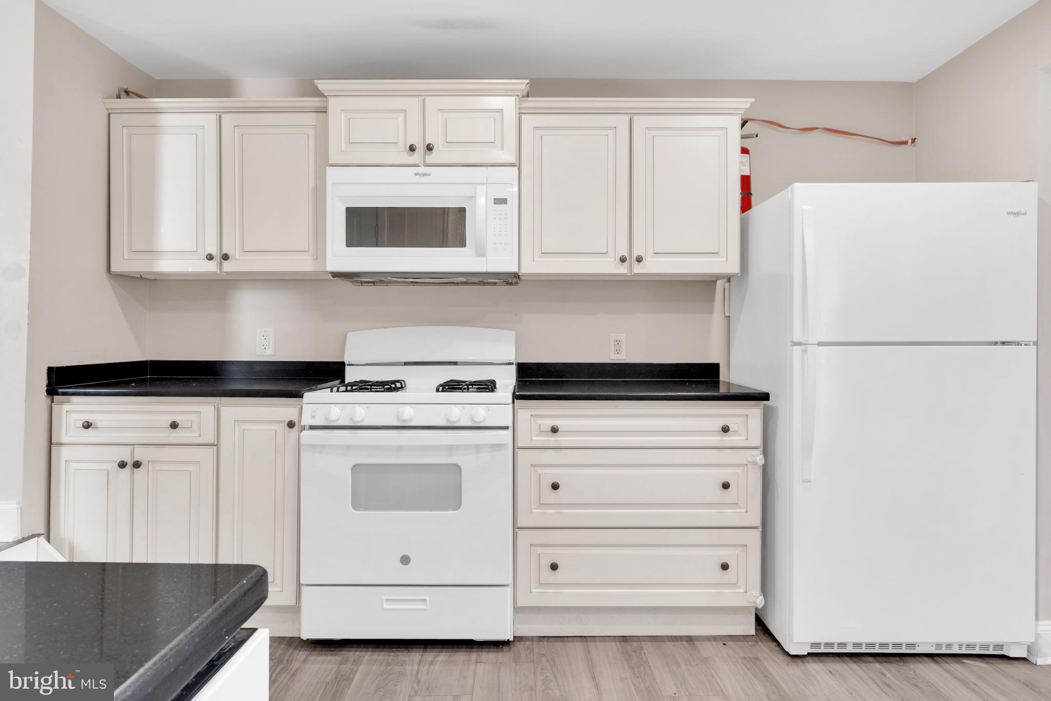19 Pleasant Street Southampton, NJ 08088 - Photo 2 of 23 a kitchen with white cabinets and white appliances