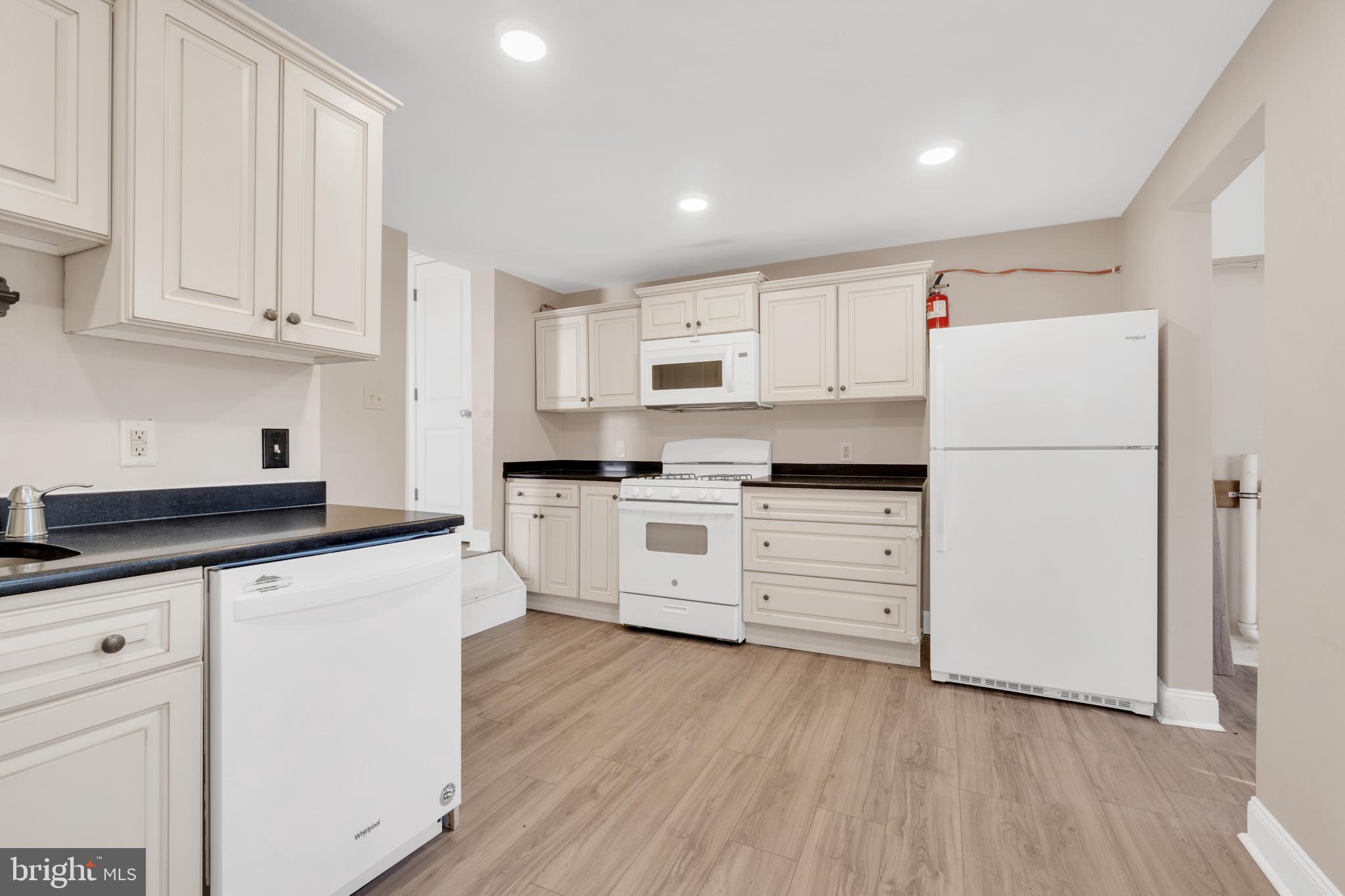 19 Pleasant Street Southampton, NJ 08088 - Photo 3 of 23 a kitchen with granite countertop white cabinets and white appliances