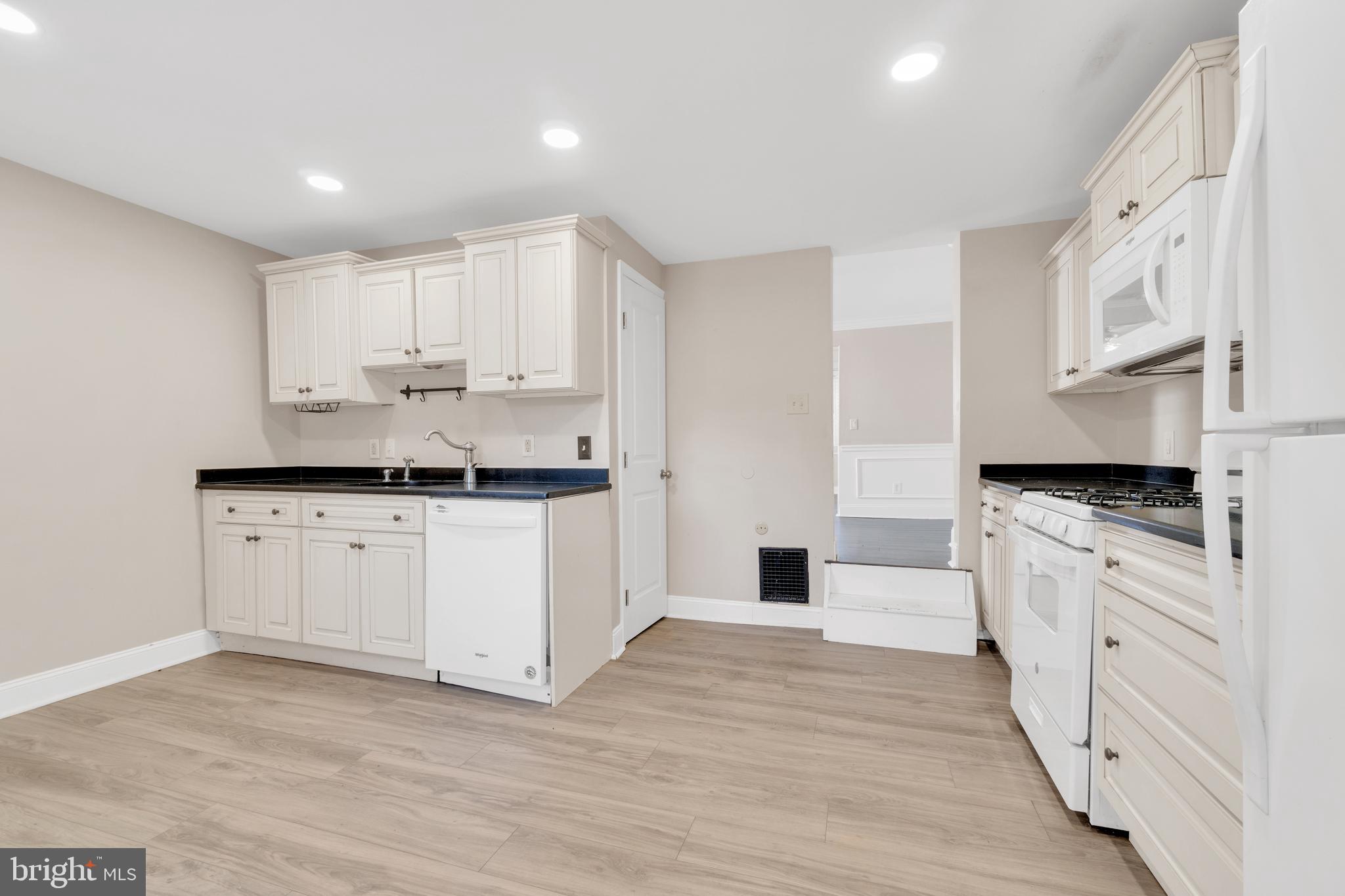 19 Pleasant Street Southampton, NJ 08088 - Photo 4 of 23 a kitchen with stainless steel appliances white cabinets a sink a stove a refrigerator and white cabinets