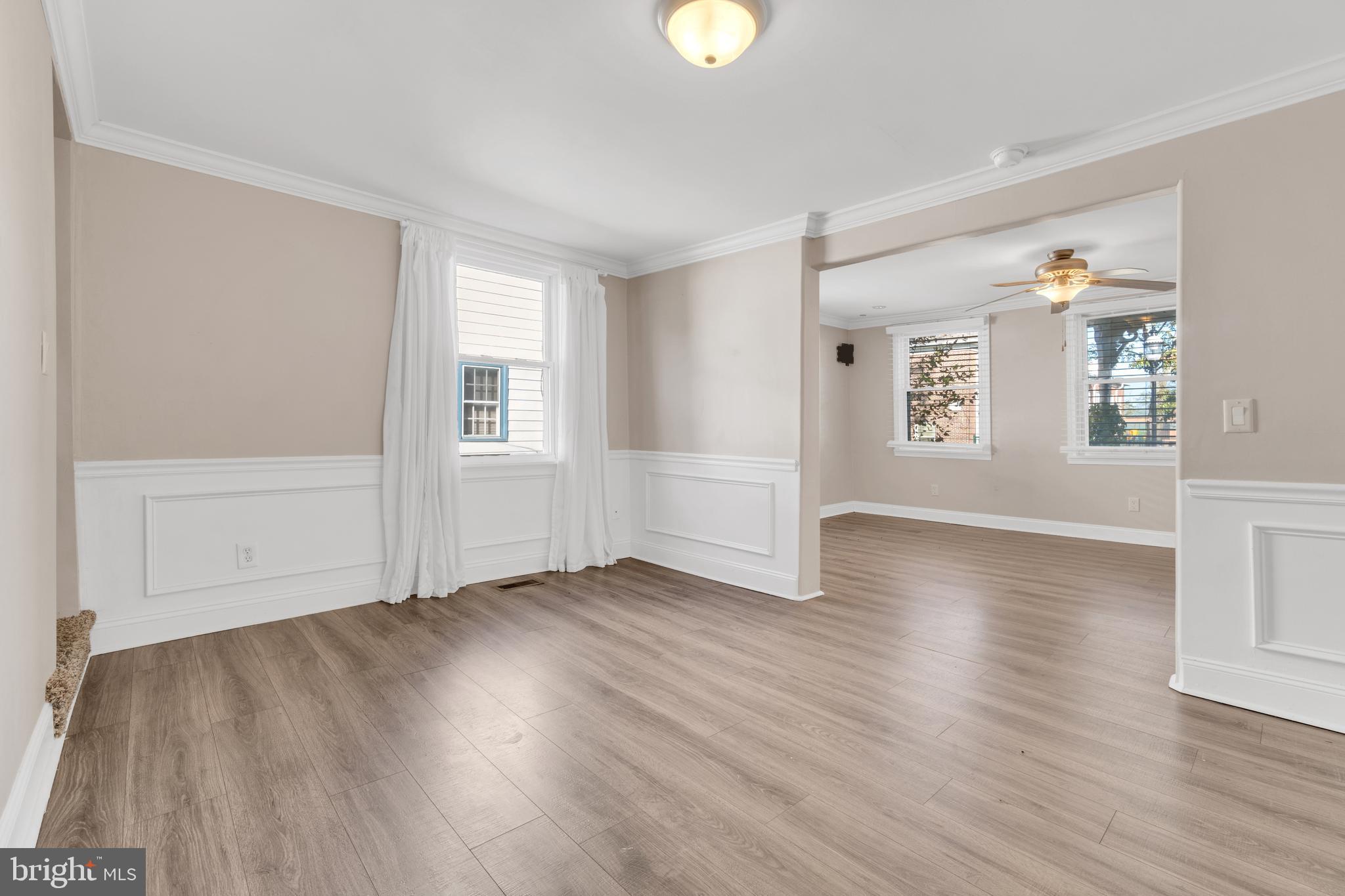 19 Pleasant Street Southampton, NJ 08088 - Photo 5 of 23 an empty room with wooden floor and windows