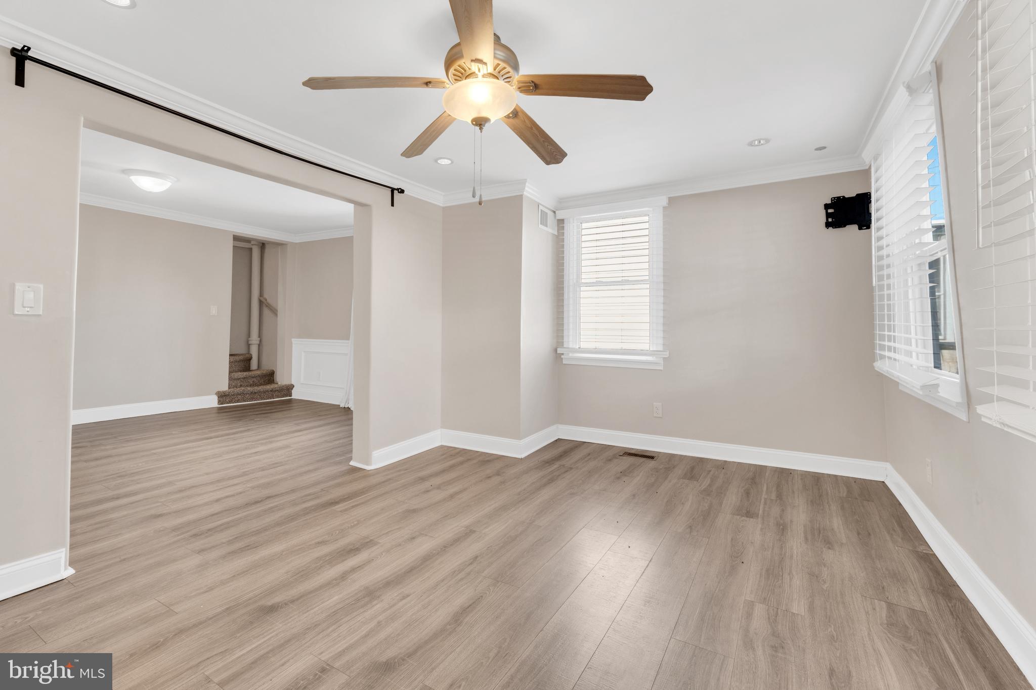 19 Pleasant Street Southampton, NJ 08088 - Photo 8 of 23 wooden floor in an empty room with a window