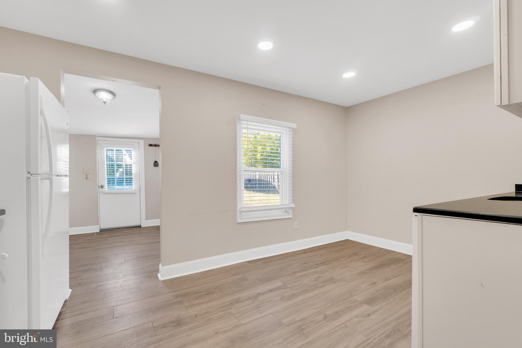 19 Pleasant Street Southampton, NJ 08088 - Photo 9 of 23 a view of an empty room with wooden floor and a window