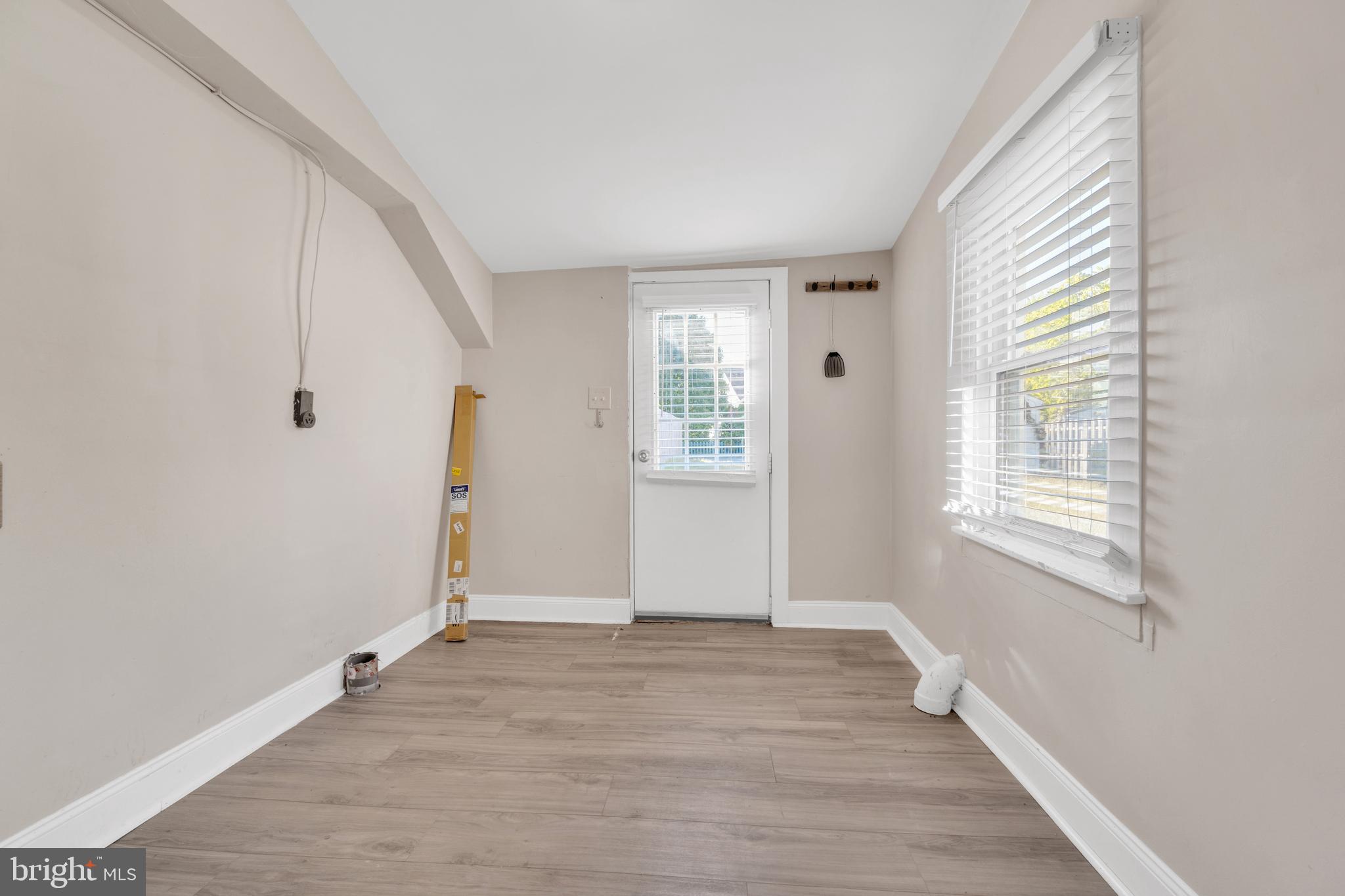 19 Pleasant Street Southampton, NJ 08088 - Photo 10 of 23 a view of an empty room with wooden floor and a window
