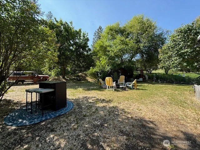 a view of a yard with a slide