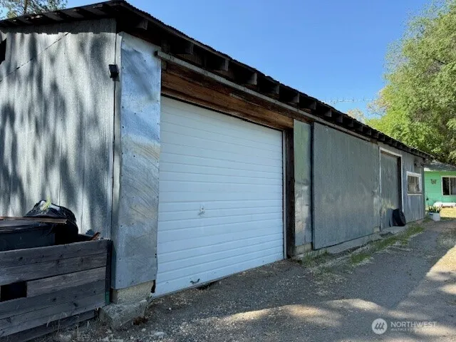 a black car parked in front of a house