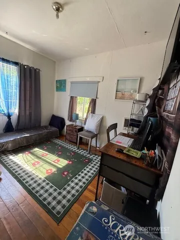 a living room with lots of furniture and a rug