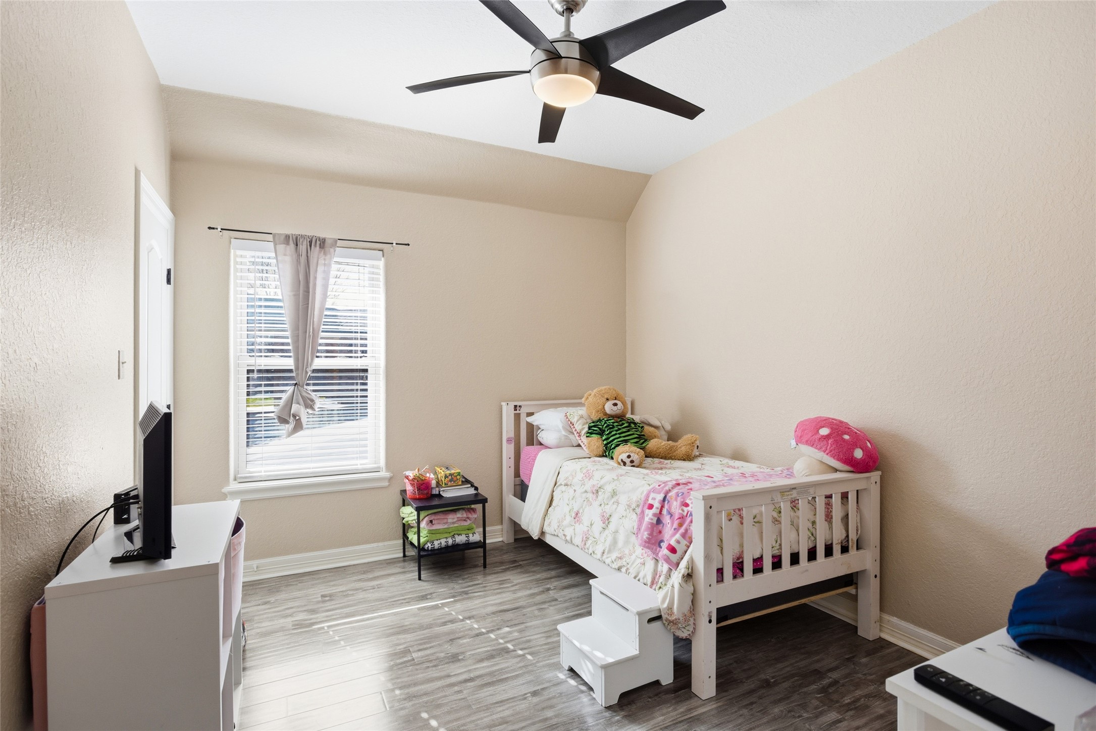 104 Hamilton Clute, TX 77531 - Photo 15 of 25 a bedroom with a bed table and a window