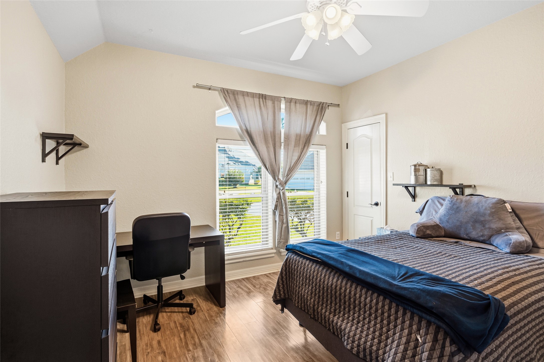 104 Hamilton Clute, TX 77531 - Photo 16 of 25 a bedroom with a large bed and a window