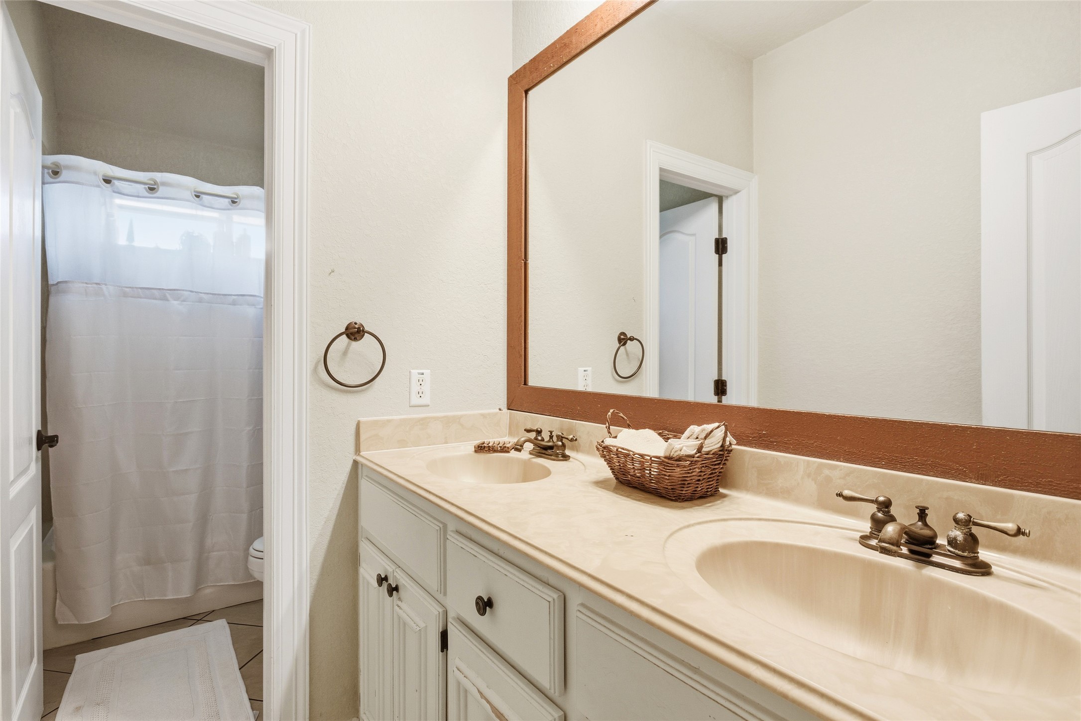 104 Hamilton Clute, TX 77531 - Photo 17 of 25 a bathroom with a granite countertop sink and a mirror