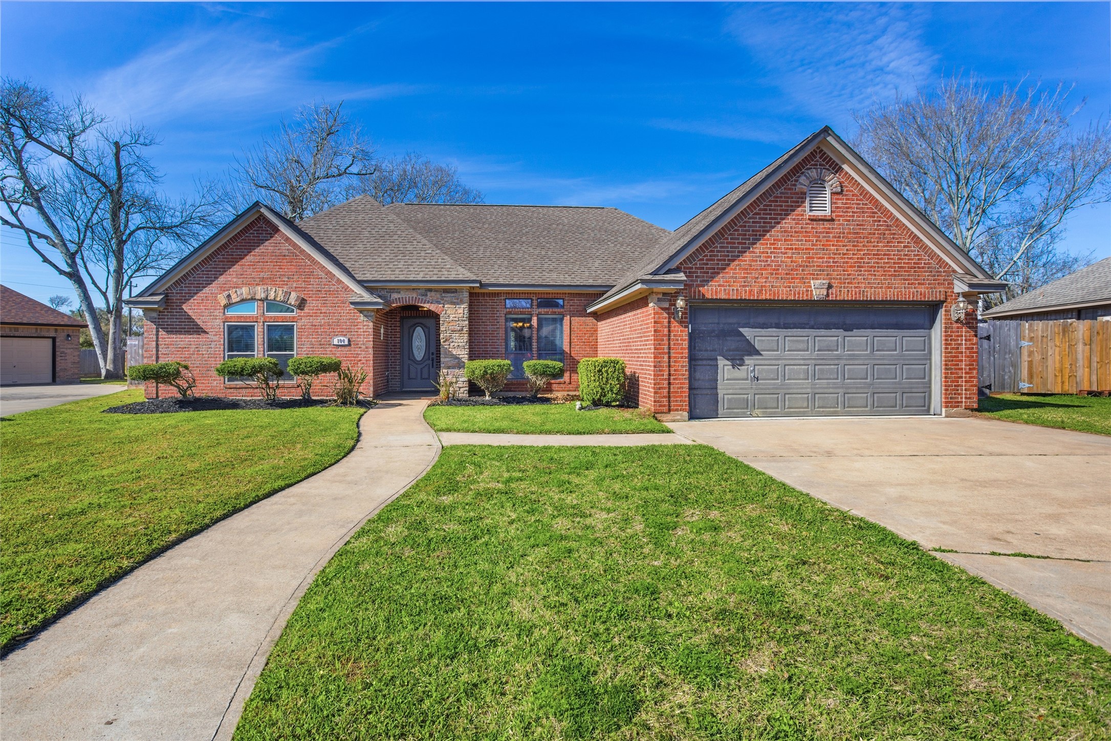 104 Hamilton Clute, TX 77531 - Photo 2 of 25 a front view of a house with a yard