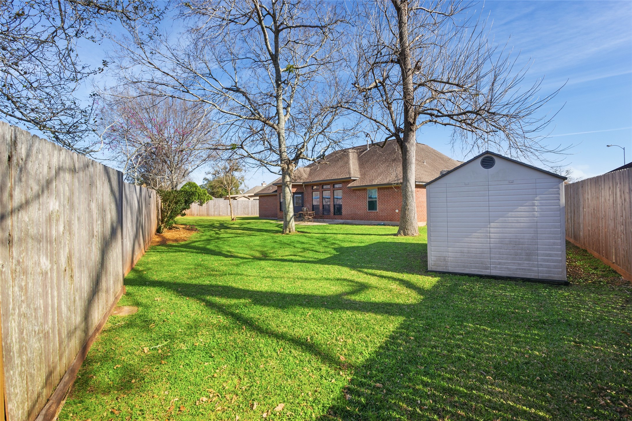 104 Hamilton Clute, TX 77531 - Photo 21 of 25 a view of a house with yard and a tree