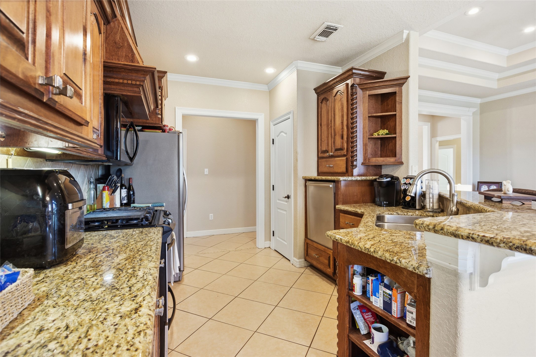 104 Hamilton Clute, TX 77531 - Photo 7 of 25 a view of a kitchen and utility room