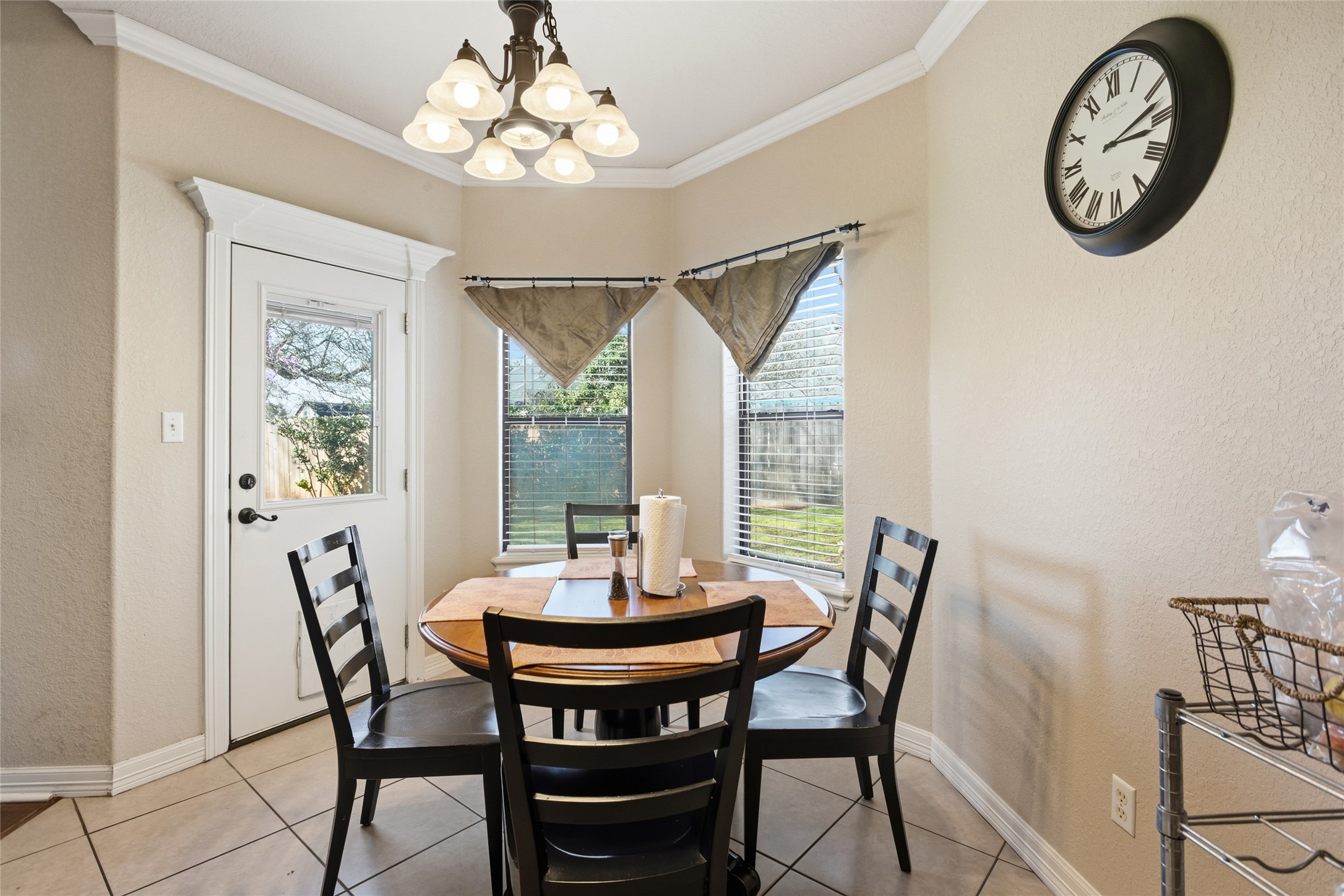 104 Hamilton Clute, TX 77531 - Photo 8 of 25 a view of a dining room with furniture a chandelier and a window