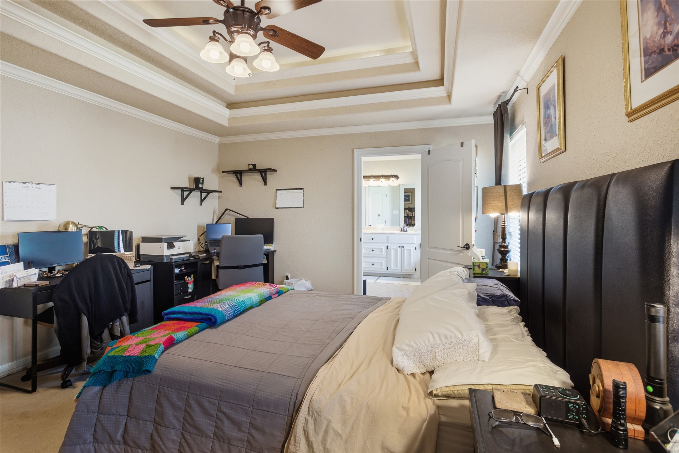 104 Hamilton Clute, TX 77531 - Photo 10 of 25 a bedroom with a bed and a chandelier