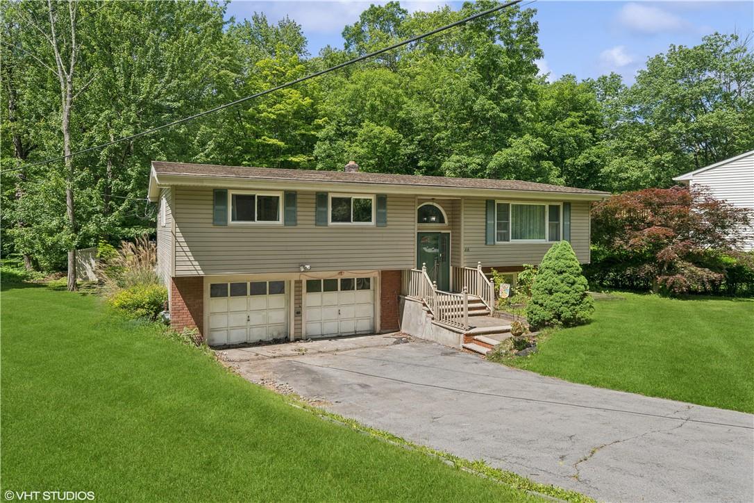 416 Round Lake Park Road Monroe, NY 10950 - Photo 1 of 1 Bi-level home featuring a garage and a front lawn