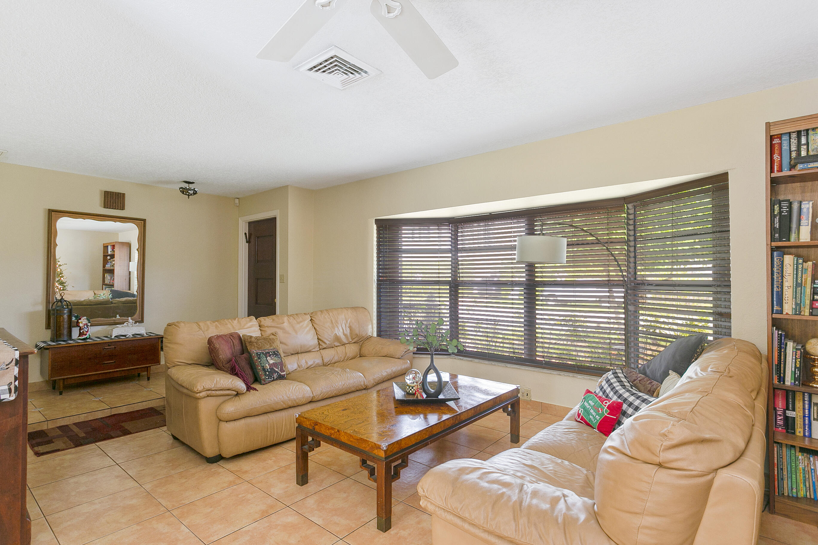 784 Northwest 7th Street Boca Raton, FL 33486 - Photo 3 of 11 a living room with furniture and a large window