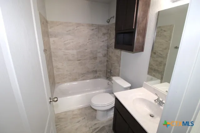 a bathroom with a sink a toilet and a bathtub