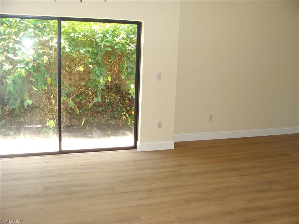 857 Reef Point Circle Naples, FL 34108 - Photo 11 of 27 a view of wooden floor and window in an ocean