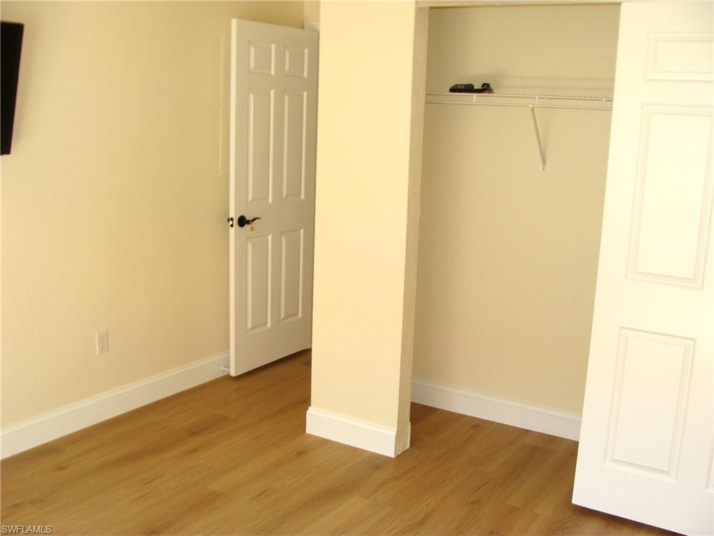 857 Reef Point Circle Naples, FL 34108 - Photo 17 of 27 a view of a small space with wooden floor