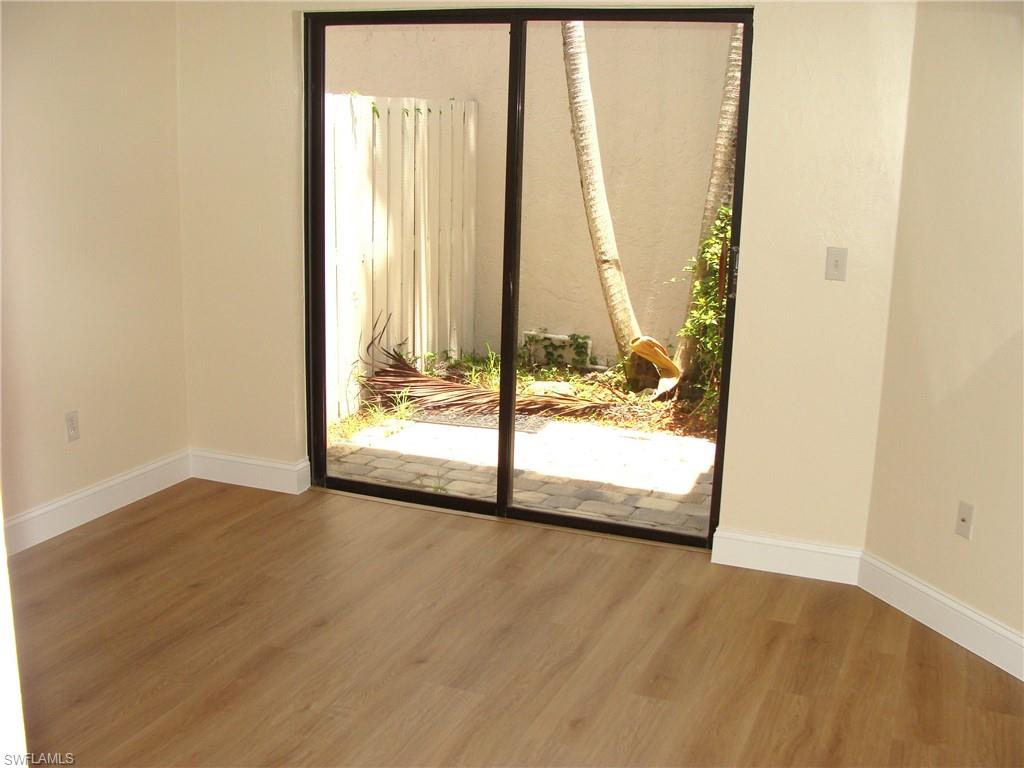857 Reef Point Circle Naples, FL 34108 - Photo 18 of 27 a view of an empty room and window