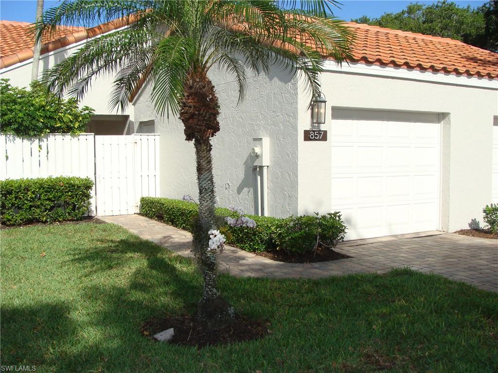 857 Reef Point Circle Naples, FL 34108 - Photo 2 of 8 a view of a backyard with a plants