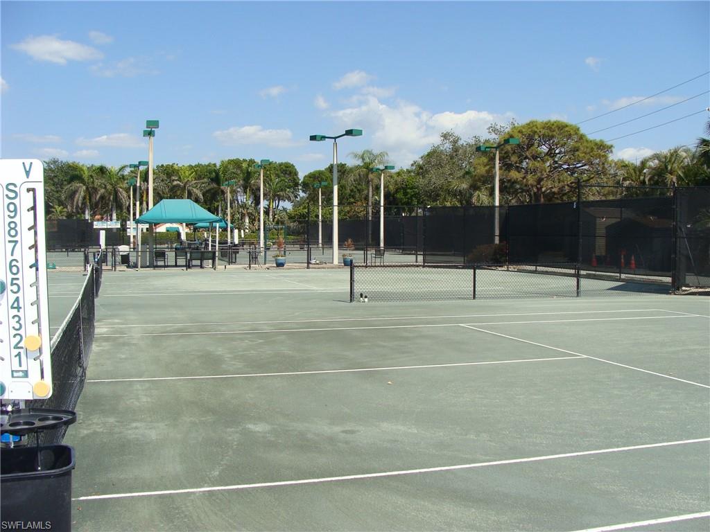 857 Reef Point Circle Naples, FL 34108 - Photo 4 of 8 a view of a basketball court