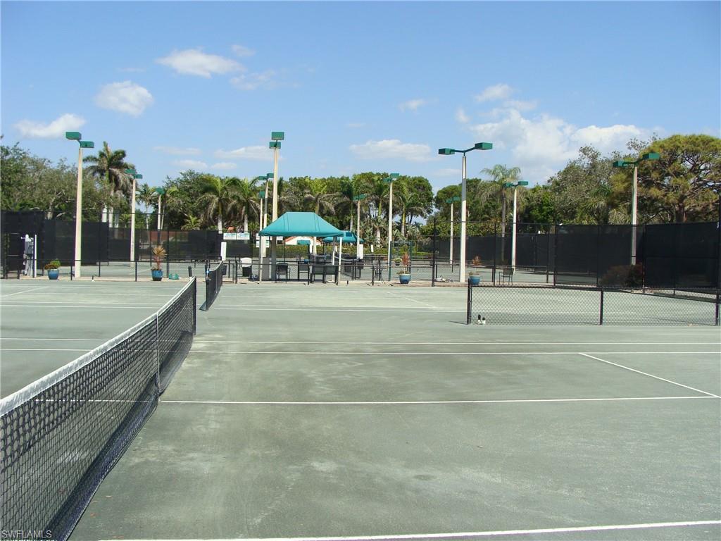857 Reef Point Circle Naples, FL 34108 - Photo 5 of 8 a view of a playground with basketball court