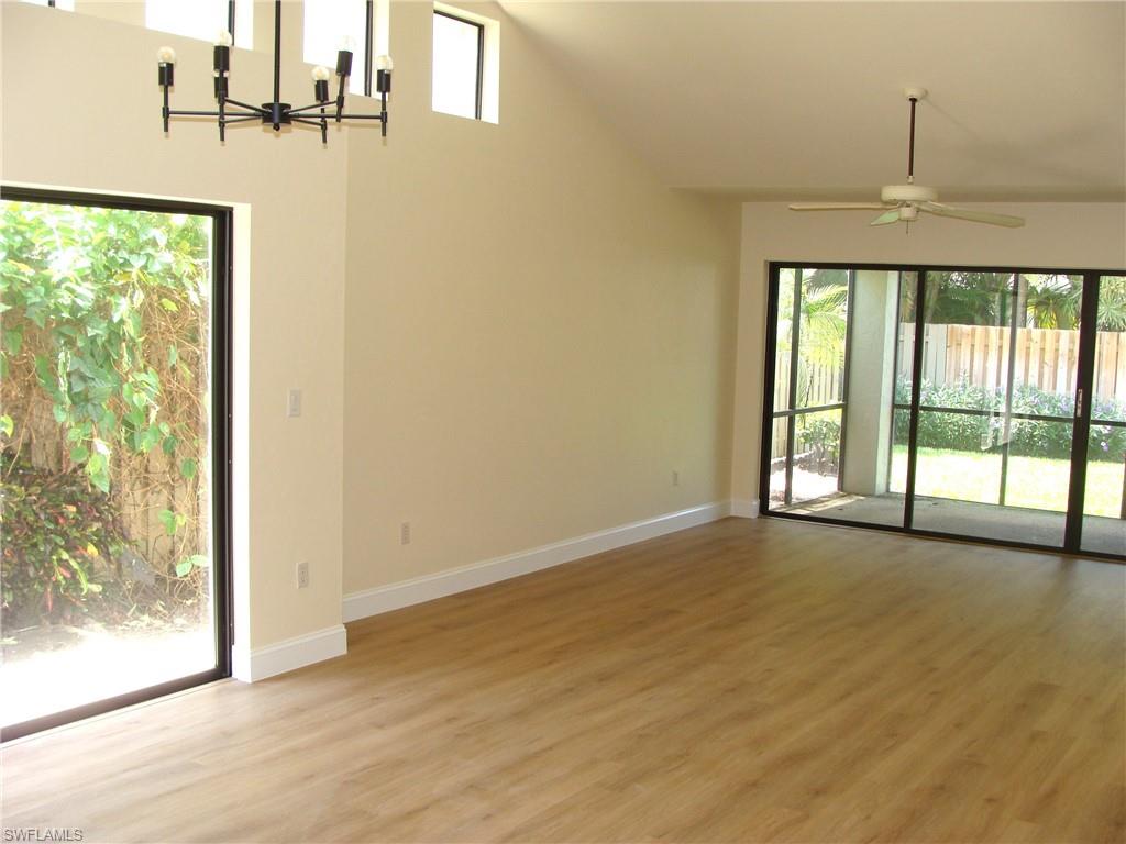 857 Reef Point Circle Naples, FL 34108 - Photo 8 of 27 a view of an empty room and window