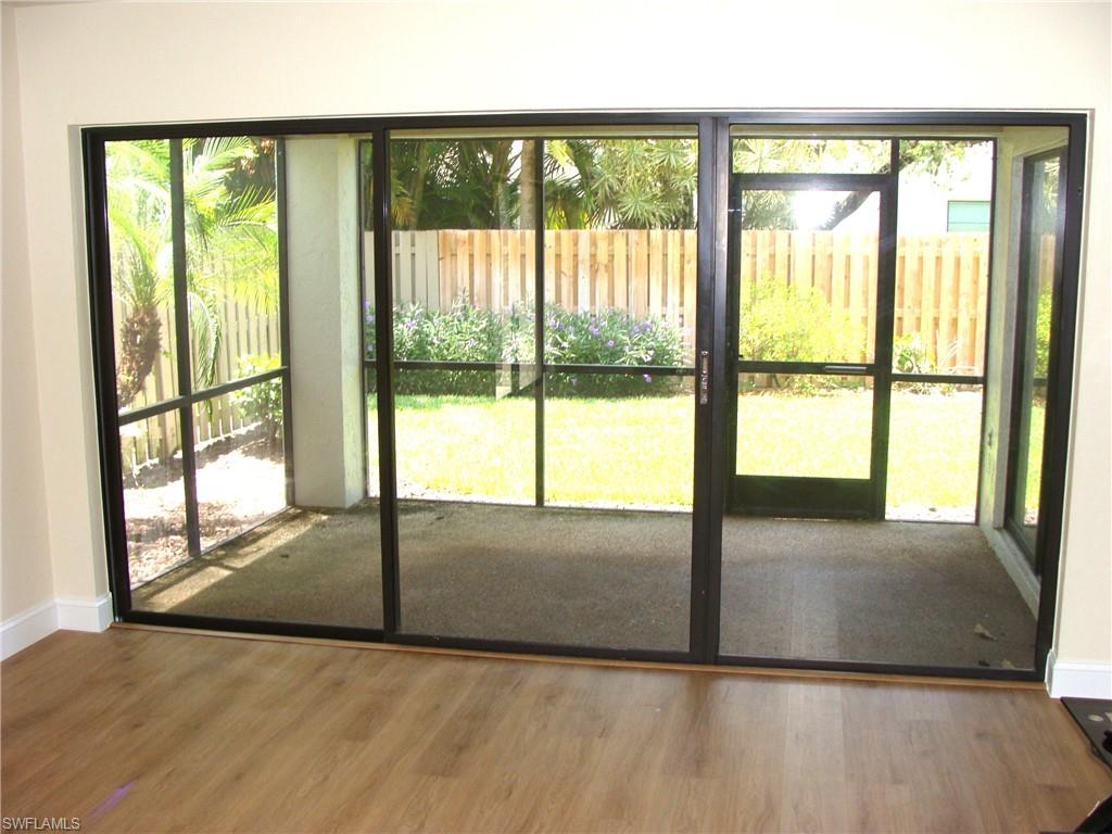 857 Reef Point Circle Naples, FL 34108 - Photo 10 of 27 a view of an empty room and window