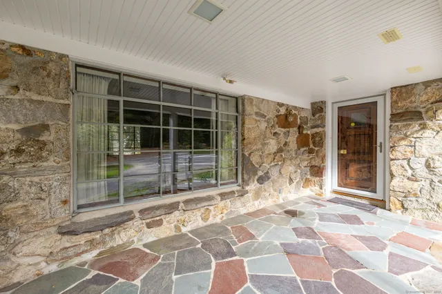 a view of empty room with windows