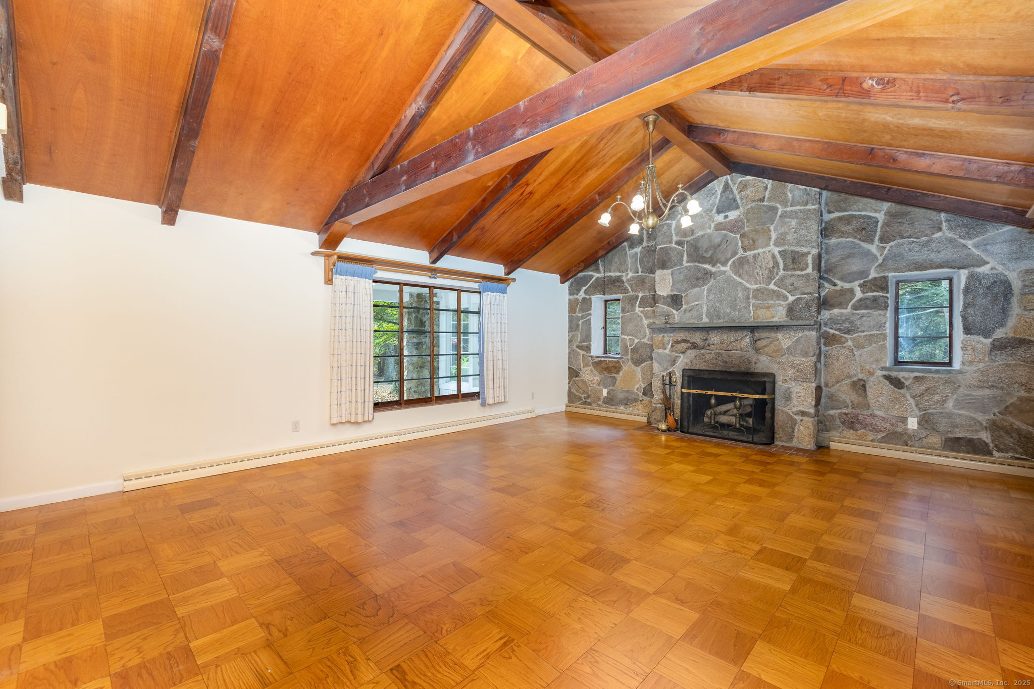 418 Plymouth Road Harwinton, CT 06791 - Photo 13 of 37 a view of an empty room with a fireplace and a window