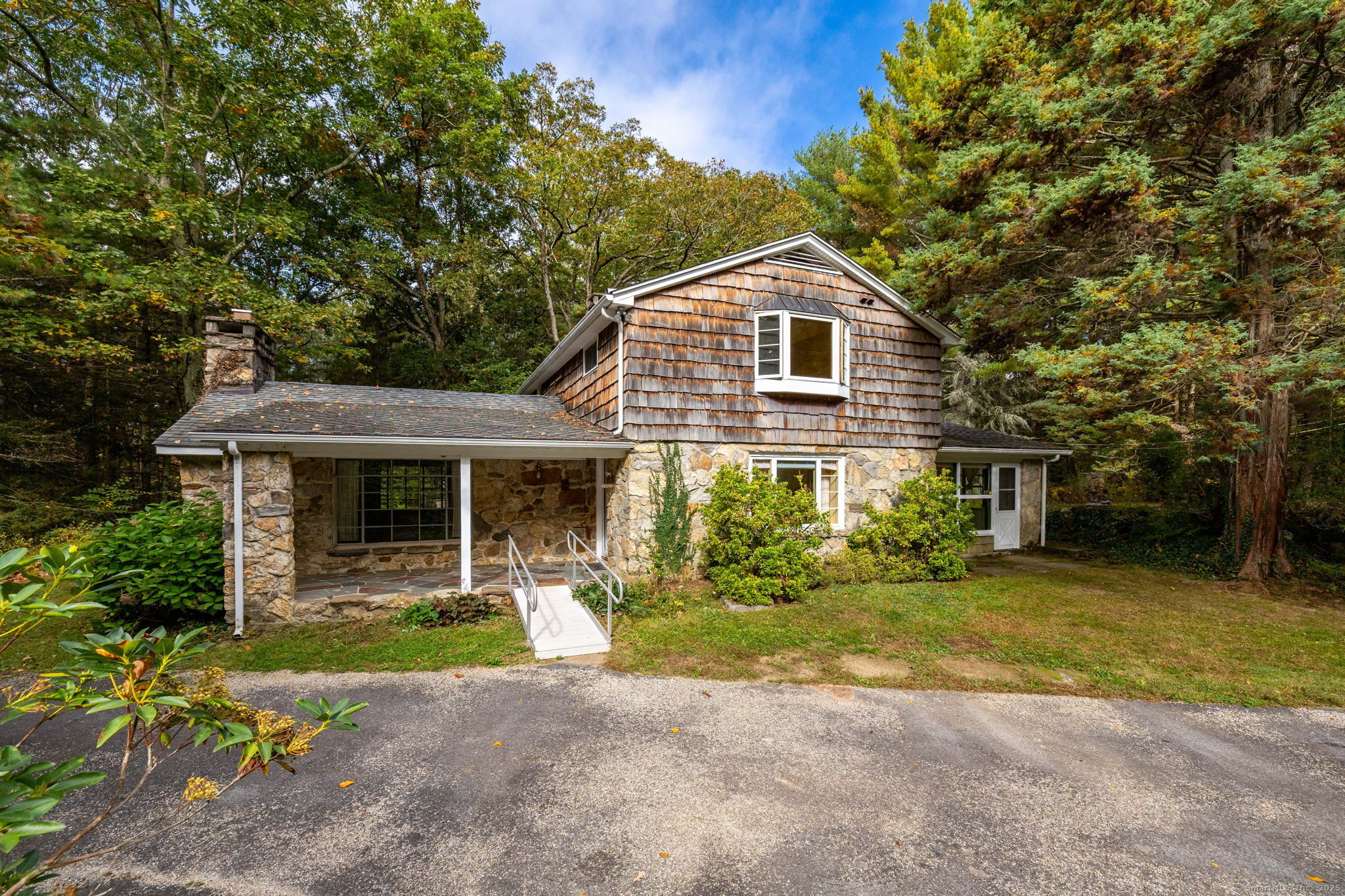 418 Plymouth Road Harwinton, CT 06791 - Photo 3 of 37 a front view of a house with a yard