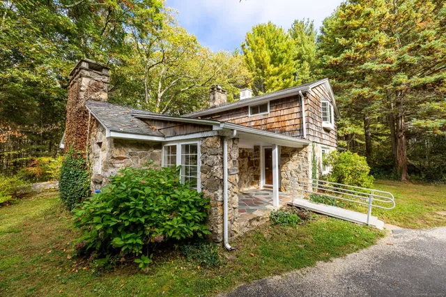 a front view of a house with garden