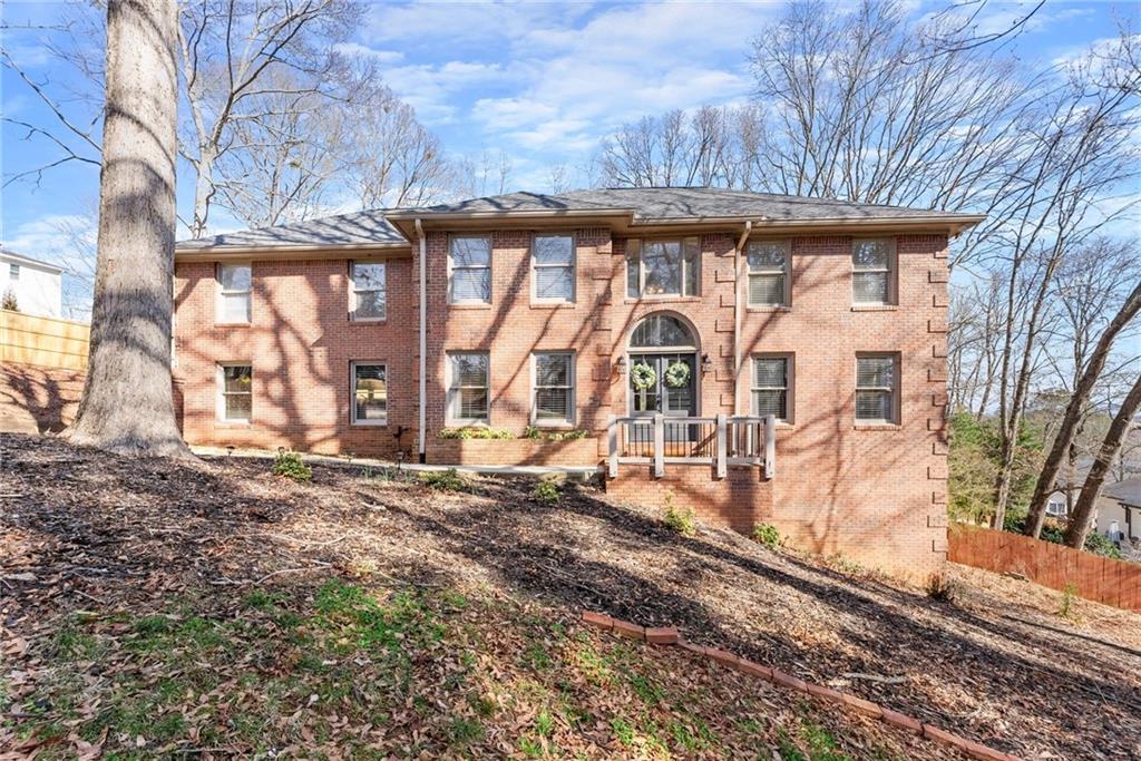 3810 Hardy Place Gainesville, GA 30506 - Photo 1 of 1 a view of a brick house with large windows