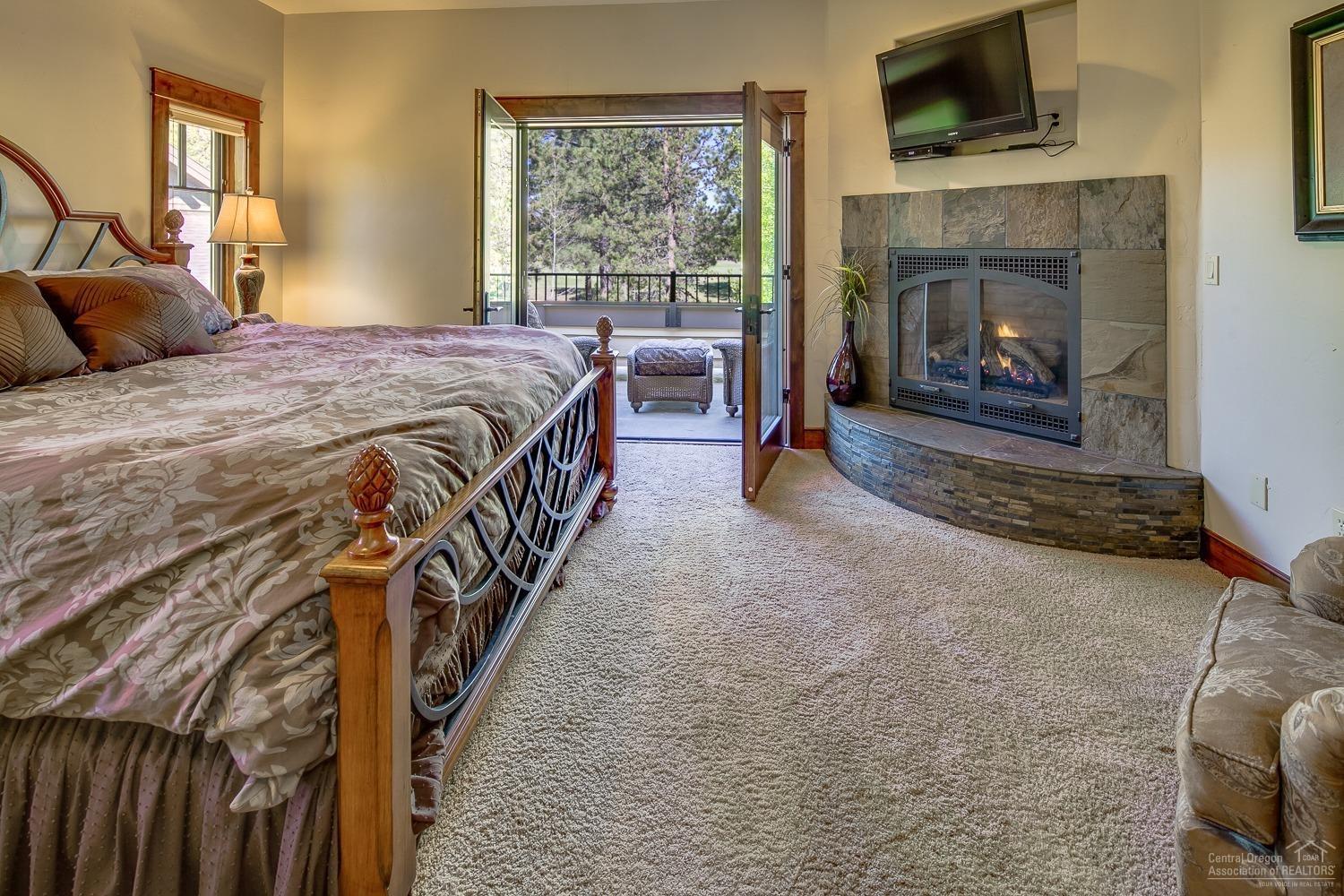 56864 Dancing Rock Loop Bend, OR 97707 - Photo 12 of 25 Second floor master with balcony and fir