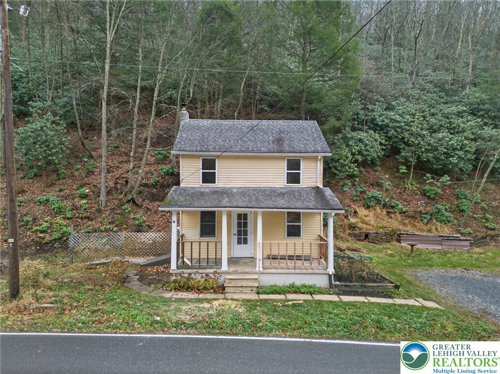 a aerial view of a house with a yard