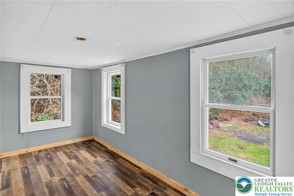 a view of an empty room with a window