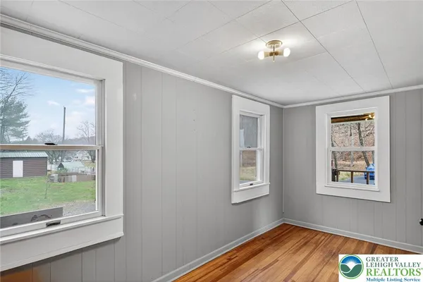 a view of an empty room with a window