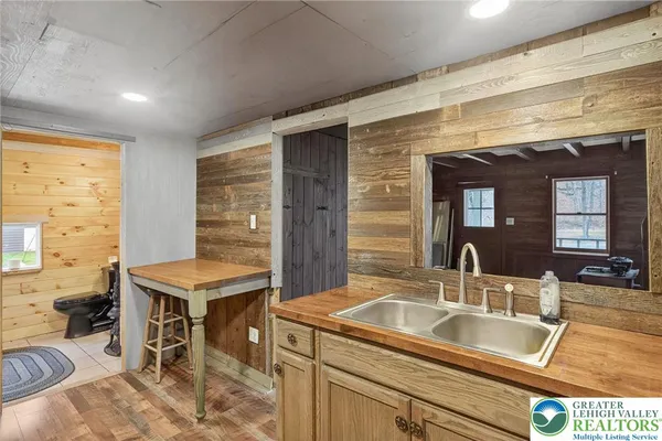 a kitchen with a sink cabinets and dining table