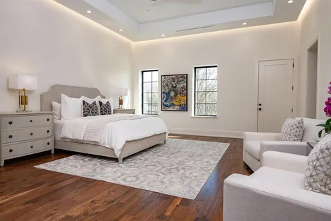 a bedroom with a bed and a couch