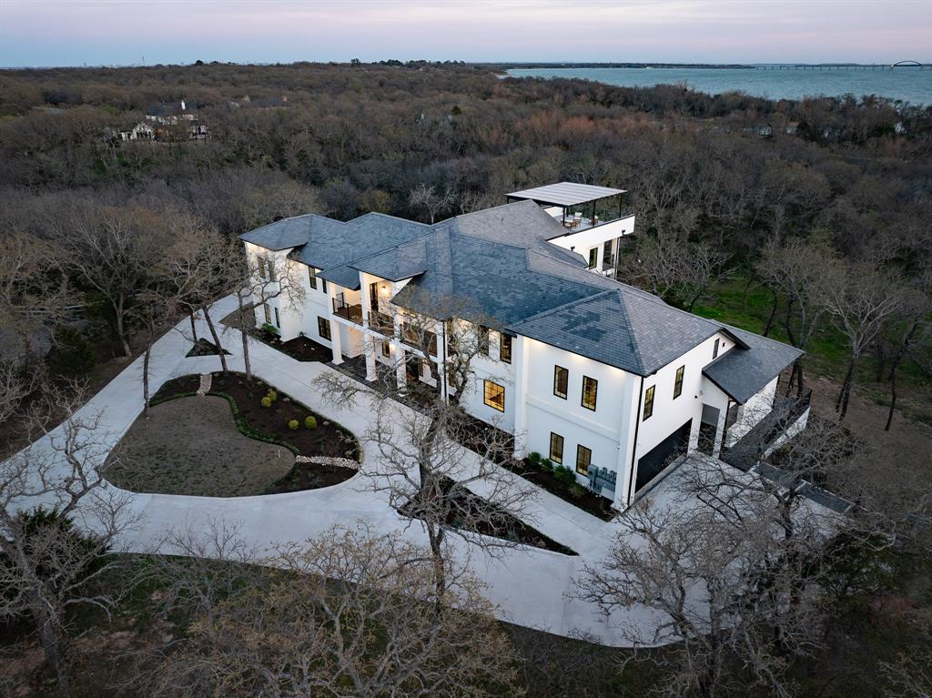 1230 Oak View Court Oak Point, TX 75068 - Photo 2 of 33 an aerial view of a house with a yard and mountain view